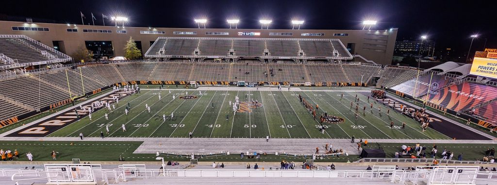 A football stadium lit up for a night game